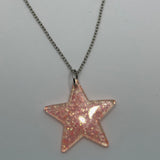 Lots of colours , Glitter star necklace, pendant on a gold or silver chain. 18 inches