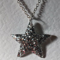 Lots of colours , Glitter star necklace, pendant on a gold or silver chain. 18 inches