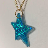 Lots of colours , Glitter star necklace, pendant on a gold or silver chain. 18 inches