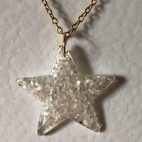 Lots of colours , Glitter star necklace, pendant on a gold or silver chain. 18 inches