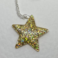 Lots of colours , Glitter star necklace, pendant on a gold or silver chain. 18 inches