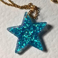 Lots of colours , Glitter star necklace, pendant on a gold or silver chain. 18 inches