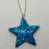 Lots of colours , Glitter star necklace, pendant on a gold or silver chain. 18 inches