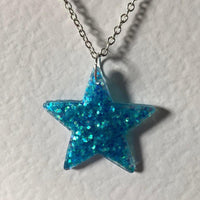 Lots of colours , Glitter star necklace, pendant on a gold or silver chain. 18 inches