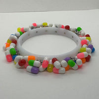 Encrusted Kitsch happy pill bangle bracelet. Rainbow bangle 2.6 inches diameter. Womens bangle